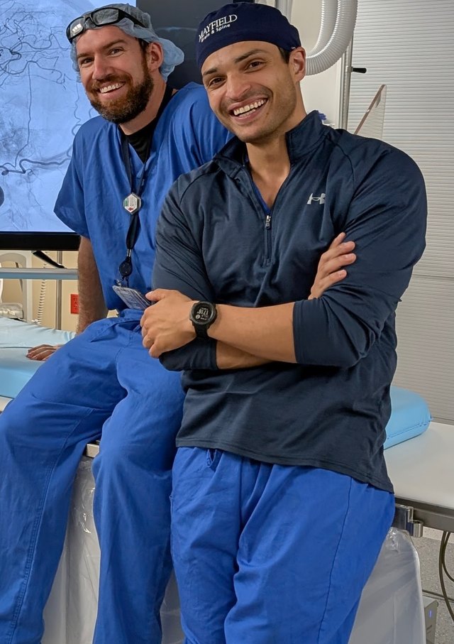 Dr. Oushy with a colleague in the angiography suite at Mayfield Brain & Spine